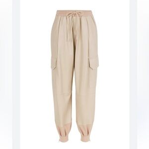 Nocturne Faux Leather Joggers Lined Cream Tan Zip Ankle Pockets NWT Size 34 XS